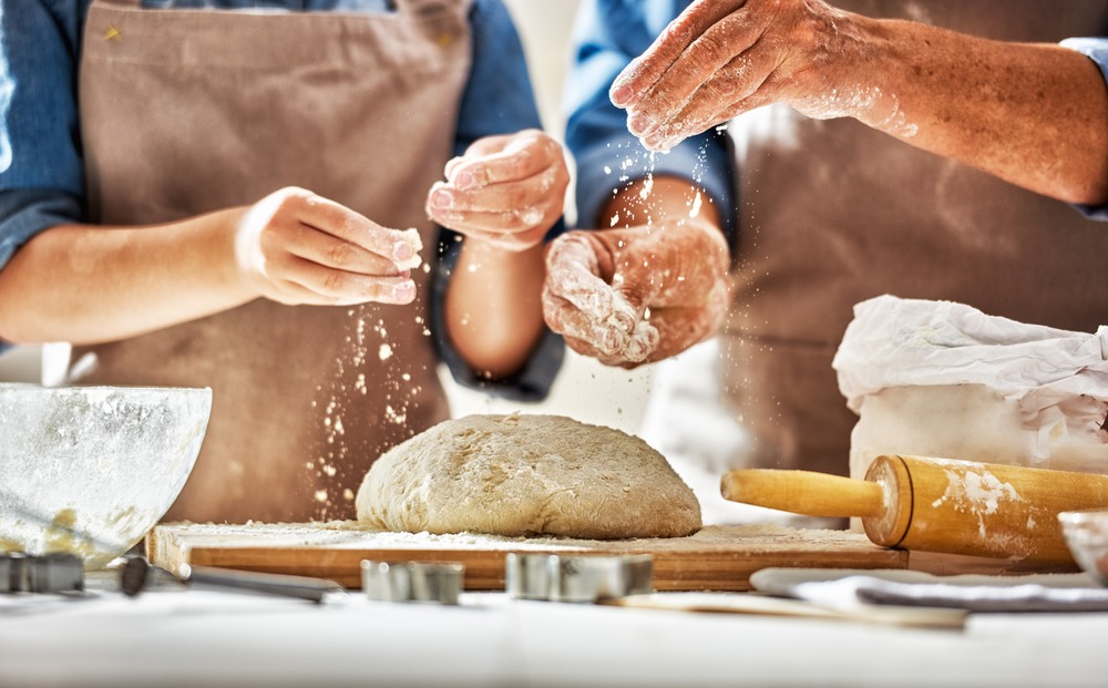 Photo of two people making bread